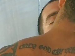 Hot tattooed studs fuck in the shower