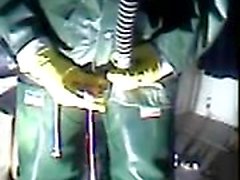 An old vid wanking in green rubber.