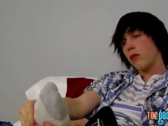 Young emo Tyler Bolt jacks off his cock and licks his toes