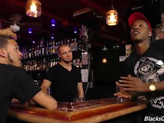 Black guys sharing the bartender at a pub