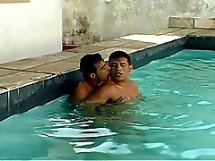 Horny gay dudes making out in the pool