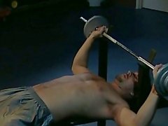 Gay hunk does some exercise naked in the garage