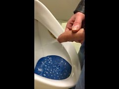 dirty boy pissing in dirty urinal